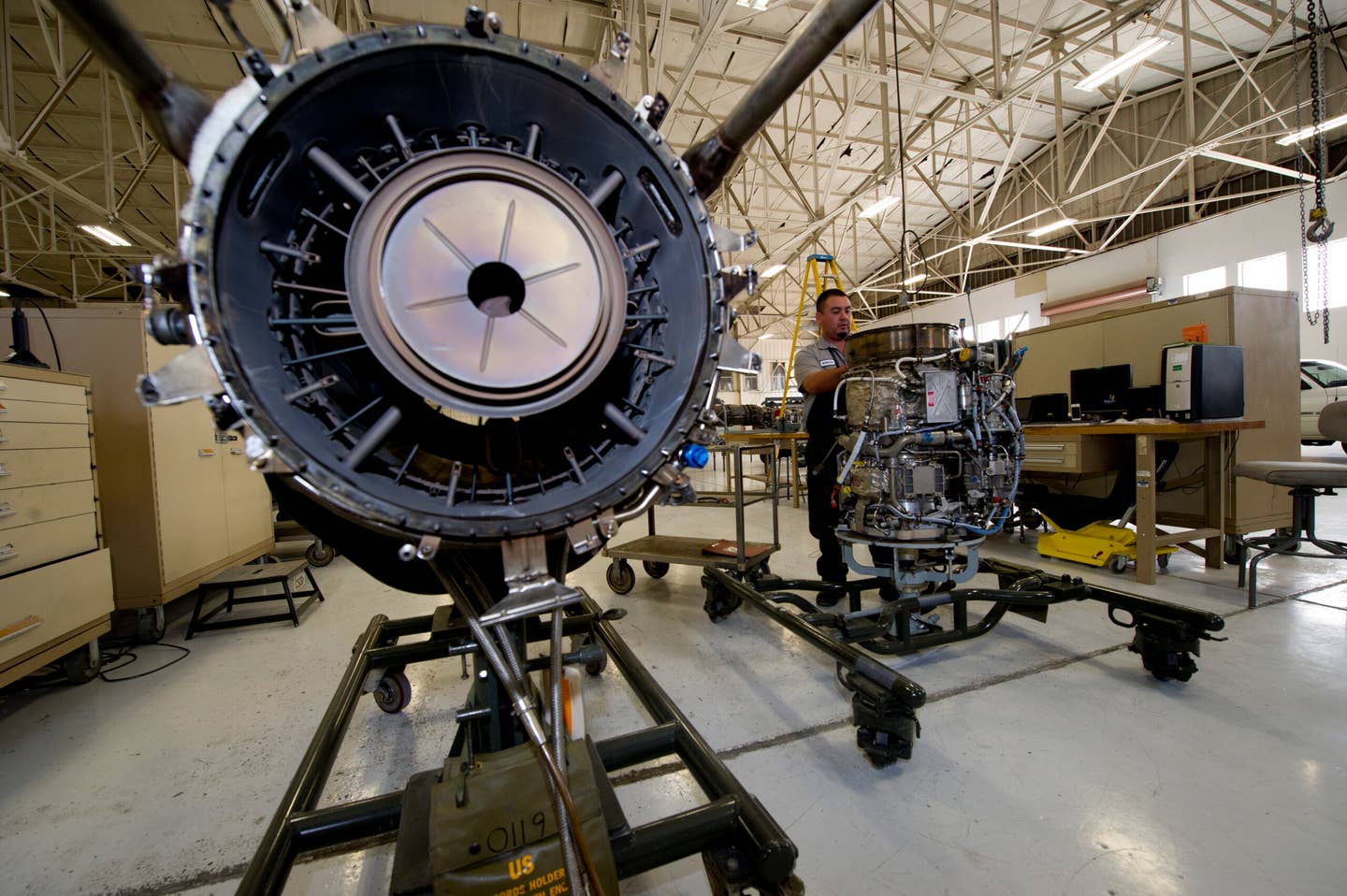 John Segovia, an aircraft engine mechanic for the T-38 Talon, finishes tearing down a J85 jet engine. Mechanics tear down and re-build jet engines regularly as a part of a maintenance routine to ensure the working order of every element within the engine. (USAF)