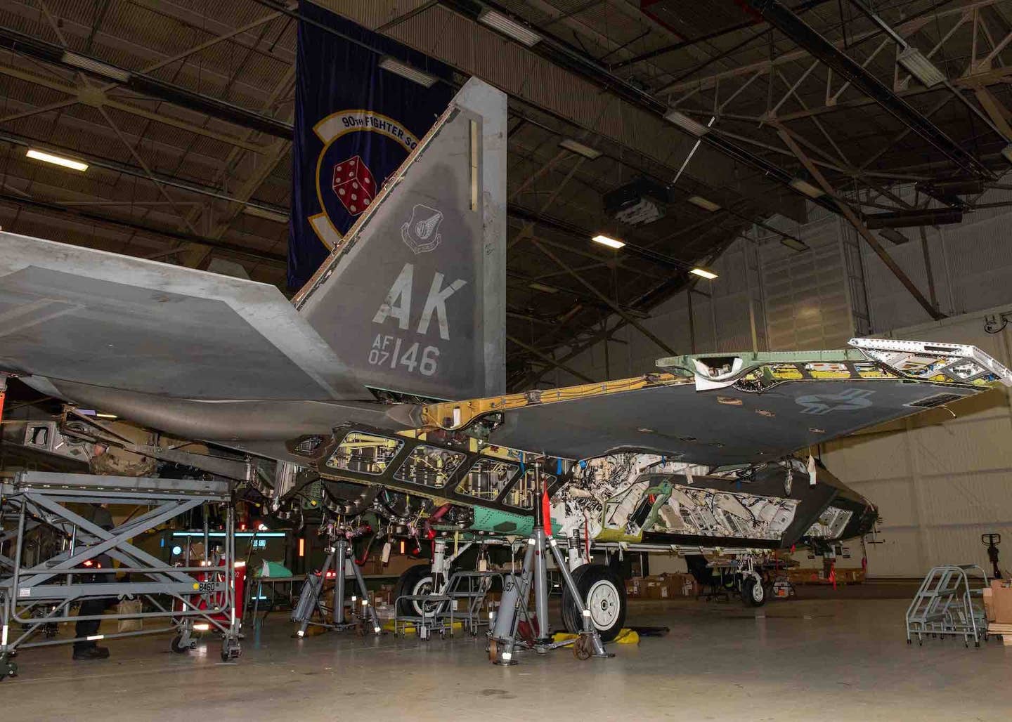 Members of the 3rd Aircraft Maintenance Squadron rebuild U.S. Air Force F-22 Raptor tail number 07-4146 at Joint Base Elmendorf-Richardson, Alaska, Nov. 29, 2021, after the aircraft was damaged in a crash in Nevada in 2018. <em>U.S. Air Force photo by Senior Airman Samuel Colvin</em>