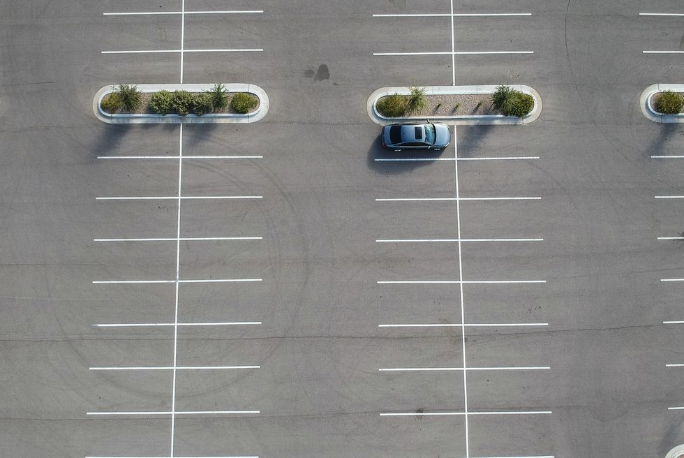 a car parked at a large parking lot