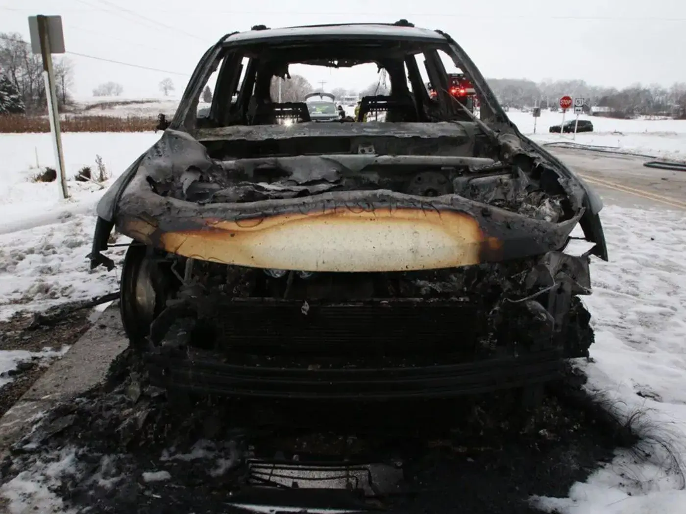 Remains of 2009 Dodge Journey destroyed in suspected electrical fire.