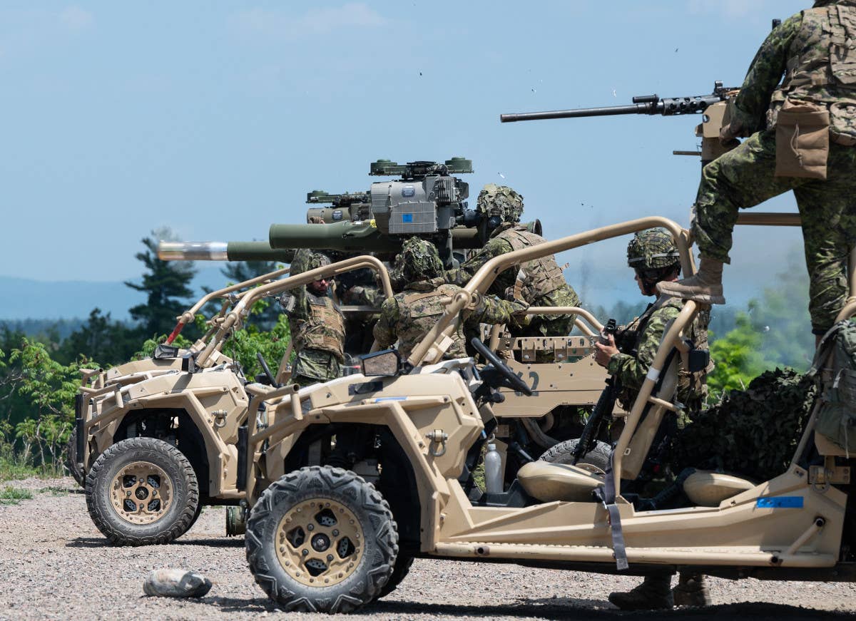 A TOW missile is seen exiting the launch tube of the launcher mounted on one of 3 RCR's MRZRs. <em>Canadian Armed Forces</em>