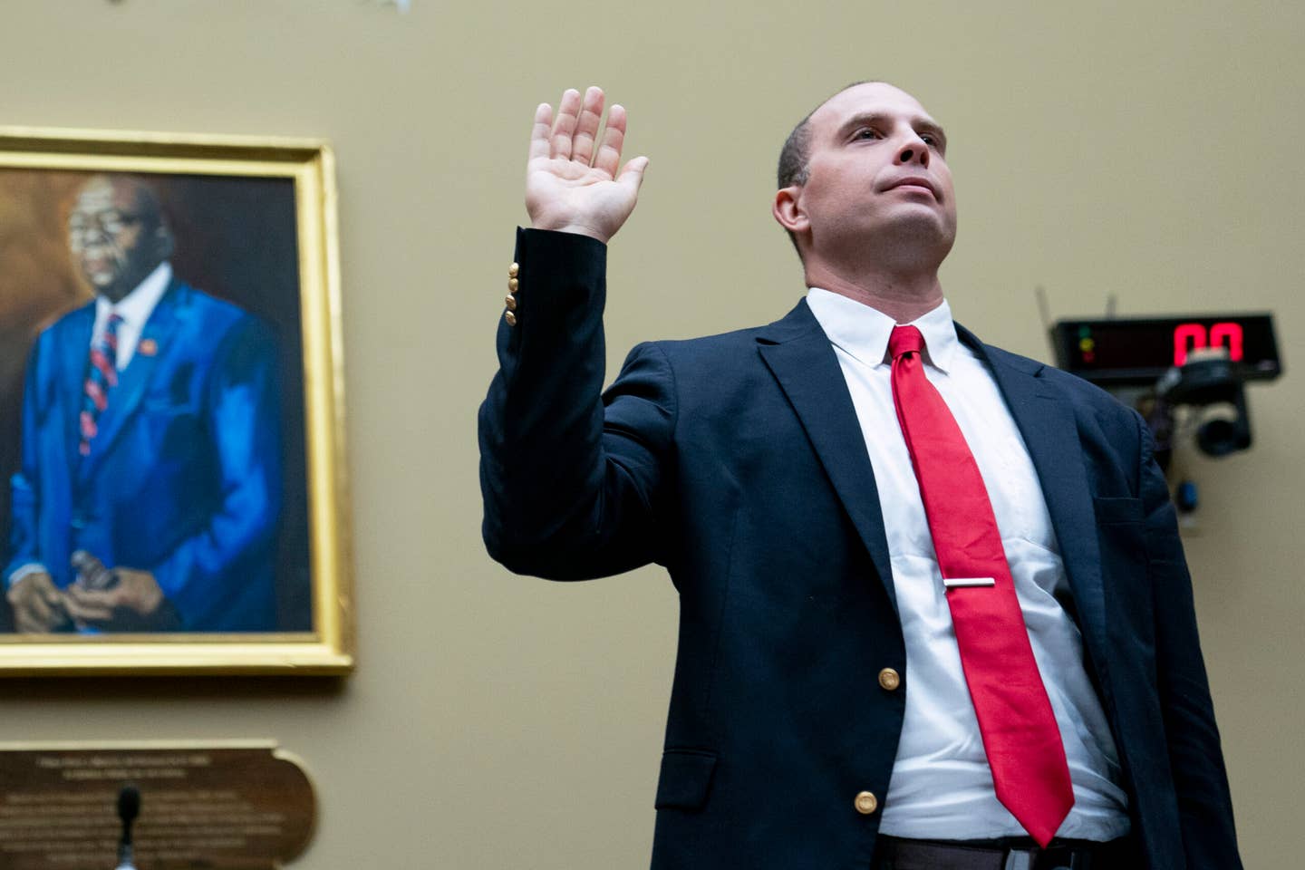 U.S. Air Force (Ret.) Maj. David Grusch, is sworn in before a House Oversight and Accountability subcommittee hearing on UFOs, Wednesday, July 26, 2023, on Capitol Hill in Washington.  (AP Photo/Nathan Howard)