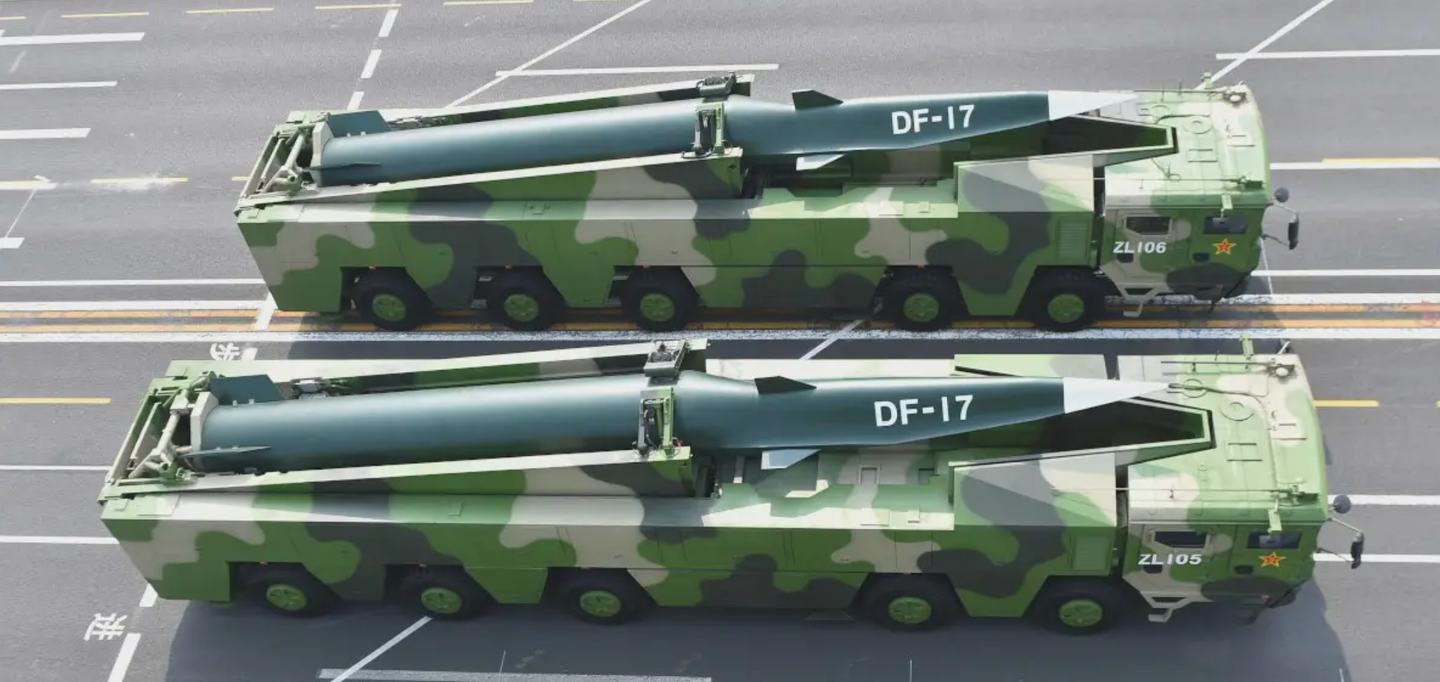 Two mockups of the Chinese DF-17 short-range ballistic missile, which carries a hypersonic boost-glide vehicle warhead. <em>China Military</em>