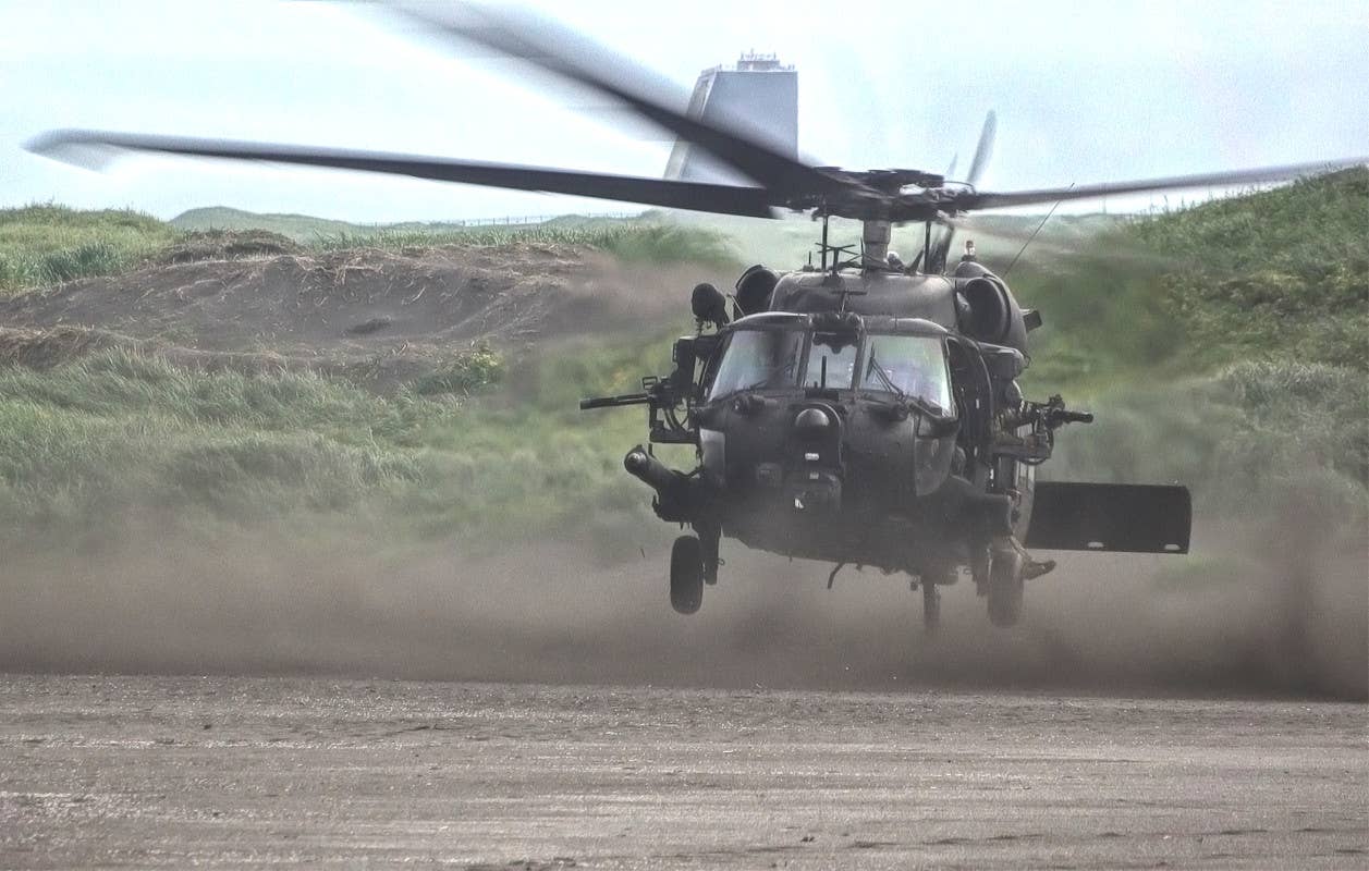 The Cobra Dane radar installation is seen in the background of this picture of an MH-60M helicopter from the 160th SOAR on Shemya Island during the Polar Dagger exercise. <em>US Army</em>