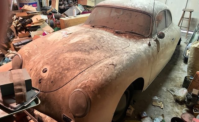 front view of dusty porsche 356 in garage