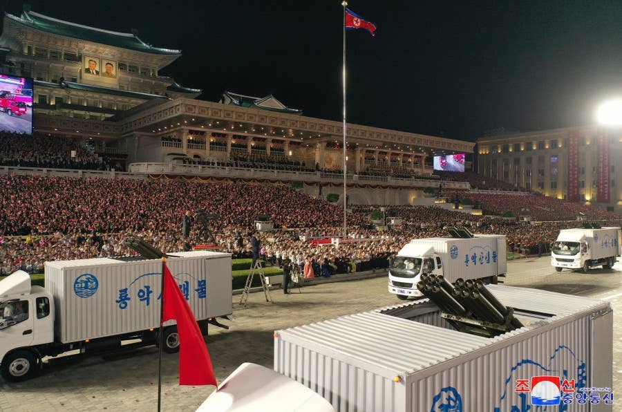 Worker-Peasant Red Guard rocket launchers concealed within container trucks during a parade in Pyongyang on September 9. <em>KCNA.</em>