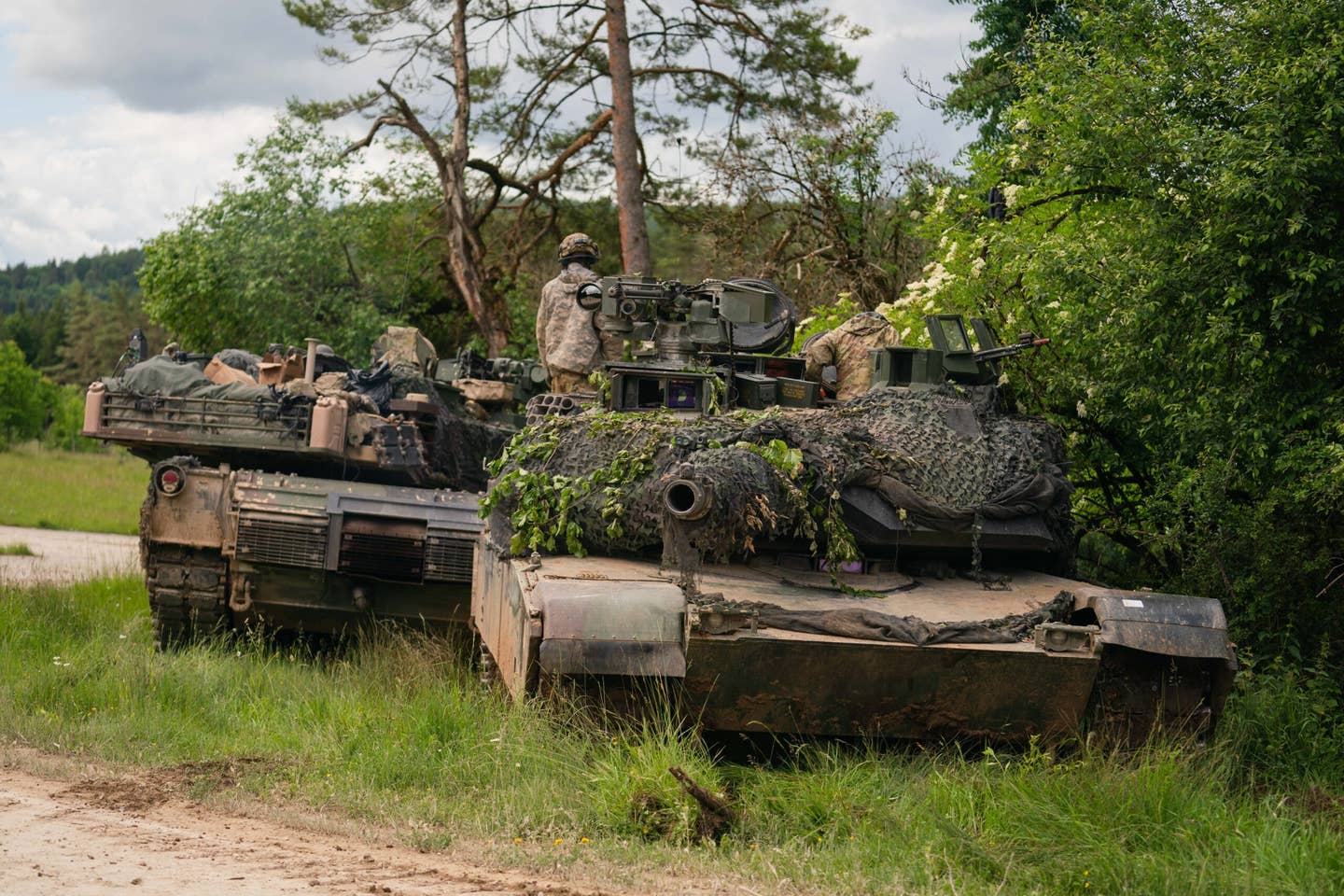 U.S. Army soldiers on an M1 Abrams tank during a multinational exercise at Hohenfels Training Area last year. <em>Photo by Nicolas Armer/Picture Alliance via Getty Images</em>