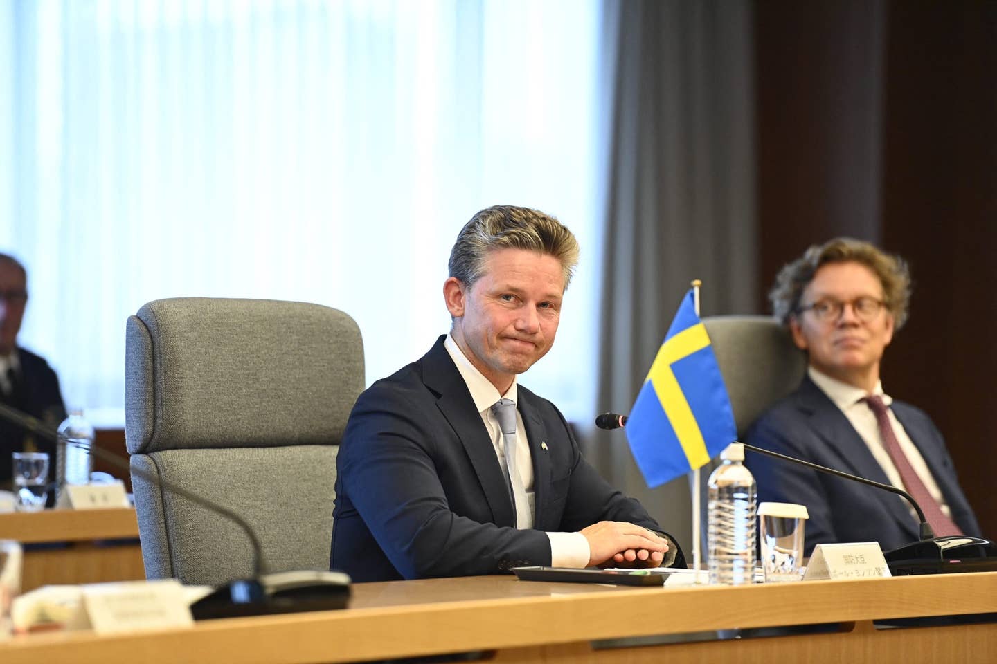 Swedish Defense Minister Pal Jonson (C) listens to Japanese Defense Minister Yasukazu Hamada (not pictured) during their Japan-Sweden bilateral meeting at the Japanese defense ministry in Tokyo on June 7, 2023. <em>Photo by David Mareuil via Getty Images</em>