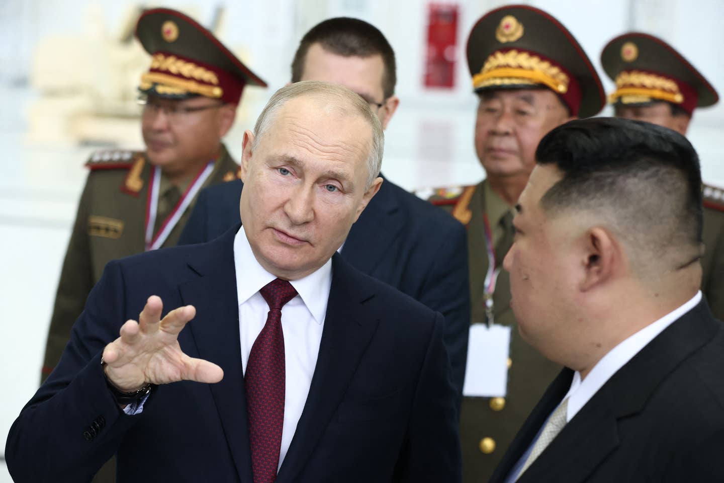 Russia's President Vladimir Putin speaks with North Korean leader Kim Jong Un as they visit the Vostochny Cosmodrome in the Amur region on September 13, 2023. <em>Photo by ARTEM GEODAKYAN/POOL/AFP via Getty Images</em>