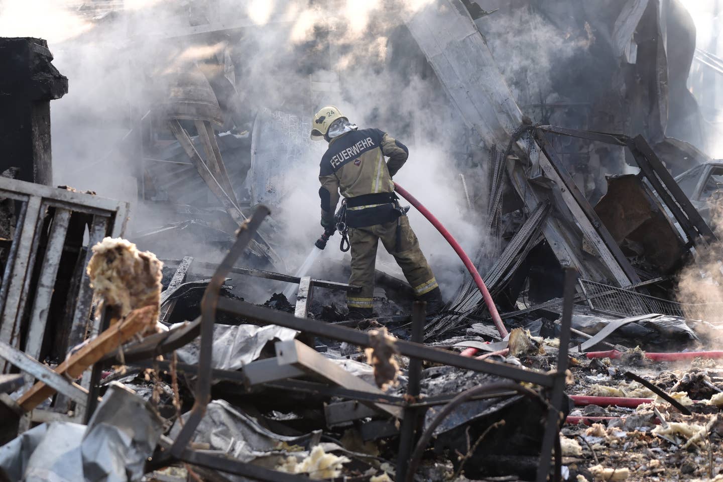 Rescuers operate at the site of a missile fragments falling in Darnytskyi district of the city on September 21, 2023 in Kyiv, Ukraine. Russia launched more than 20 missiles on the capital of Ukraine, which Ukrainian Air Defense Forces say were shot down. However, fragments of the downed missiles fell in four districts of the city, in particular Darnytskyi and Holosiivskyi. At least seven people were injured. (Photo by Vitalii Nosach/Global Images Ukraine via Getty Images)