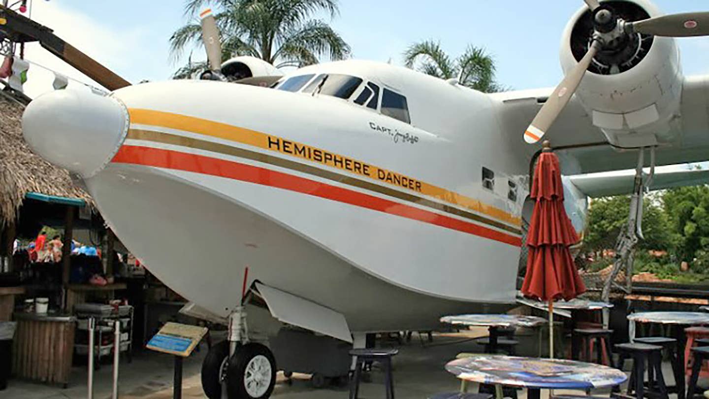 Hemisphere Dancer (Former U.S.N. BuNo. 137928) at its barstool parking place at Lone Palm Airport on Universal Studio's City Walk in Orlando, Florida. <em>Max Lonzanida/DVIDS</em>.