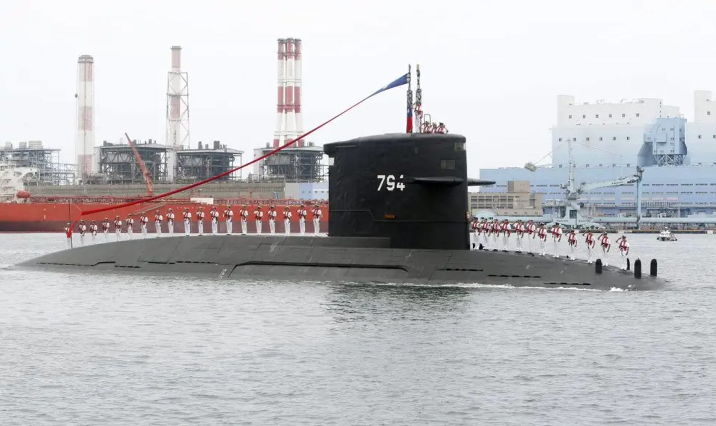 Taiwanese sailors salute aboard the <em>Hai Lung</em> class submarine <em>Hai Hu</em>, which was commissioned into ROCN service in 1988. <em>AP/Chiang Ying-ying</em>