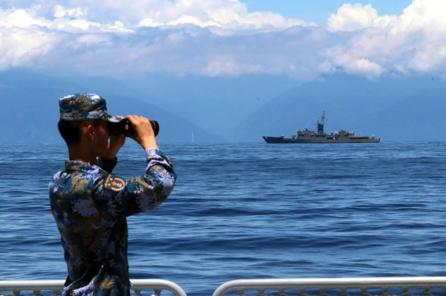 A PLA soldier looks through binoculars during combat exercises and training of the Eastern Theater Command of the Chinese People’s Liberation Army in the waters around Taiwan, August 5, 2022. <em>Photo by Lin Jian/Xinhua via Getty Images</em>