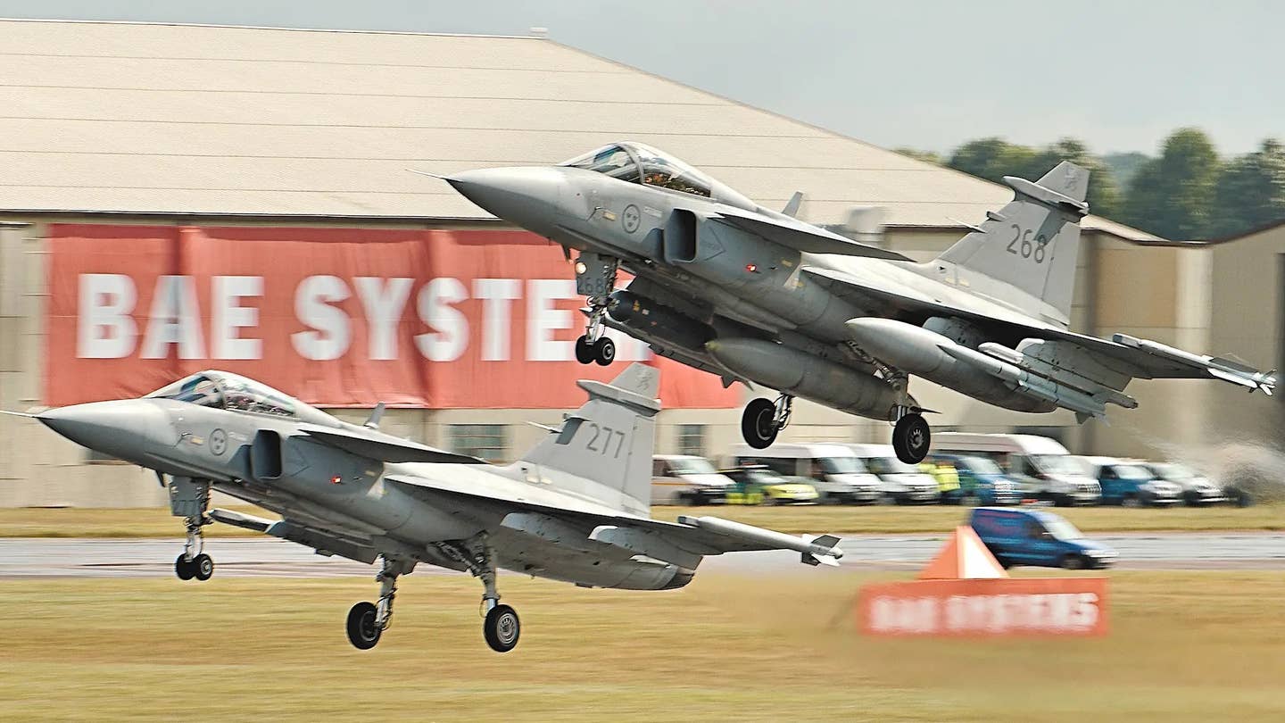 Two Swedish Gripen C fighter jets at the RIAT 2016 air show in the United Kingdom. <em>Airwolfhound via Wikimedia</em> <em>Commons, CC-BY-SA-2.0</em>