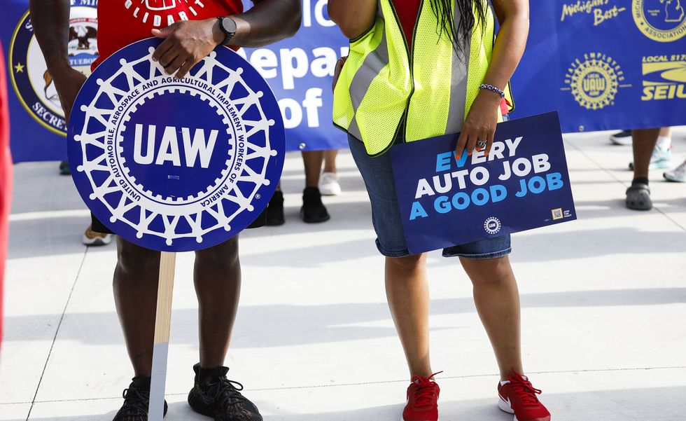 united auto workers members march in detroit labor day parade