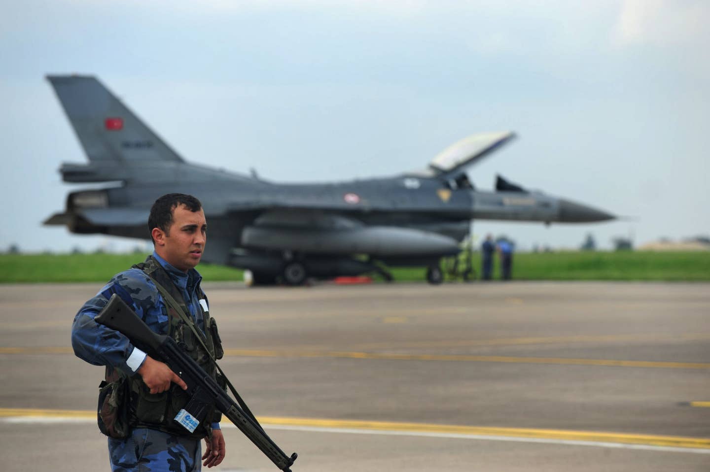 Members of the Turkish Air Force during an aircraft exercise with the U.S. Air Force Incirlik Air Base, Turkey, in 2013. The personnel were simulating a broken landing gear on an F-16 aircraft. <em>U.S. Air Force photo by Senior Airman Anthony Sanchelli</em>