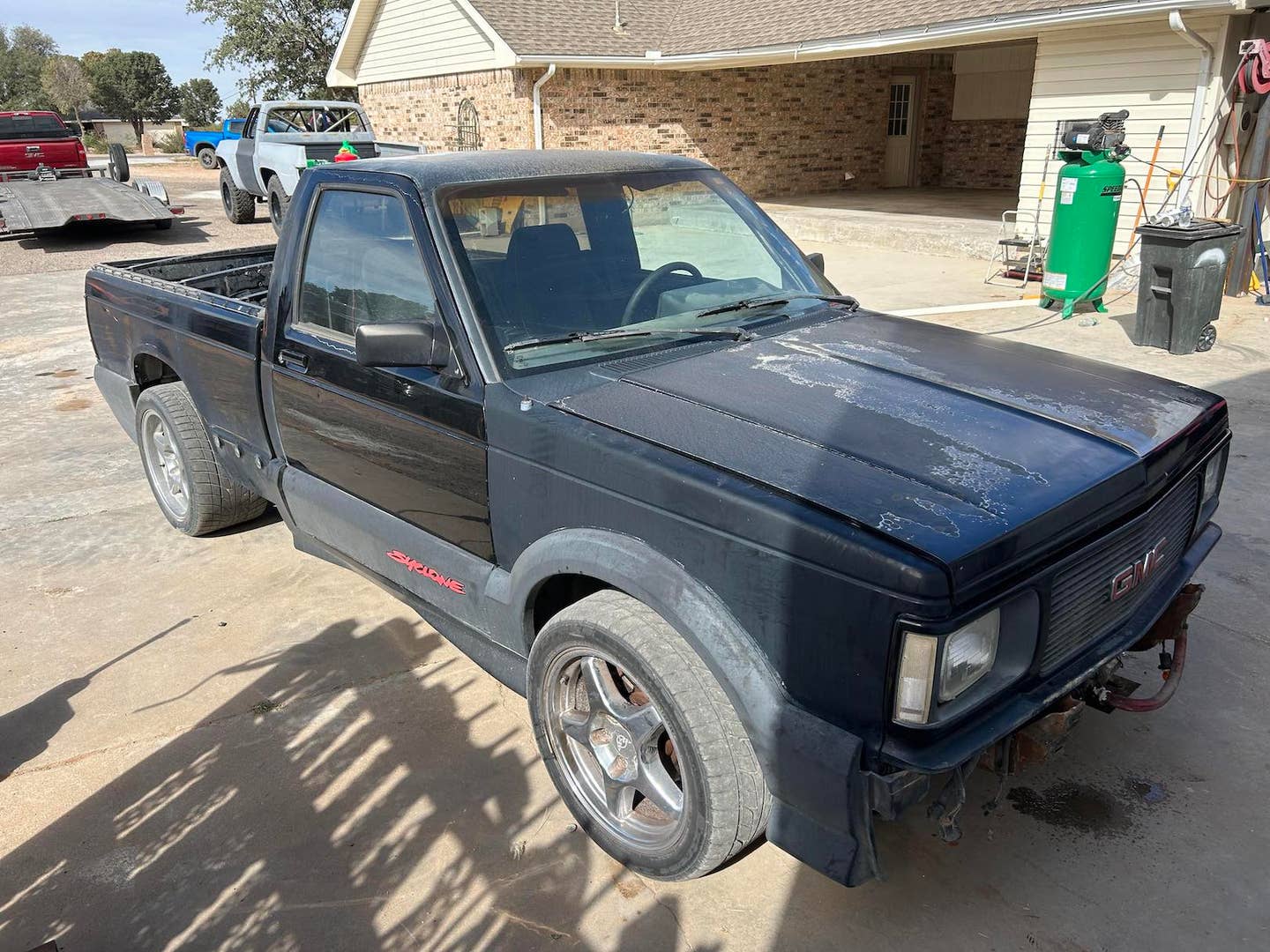 GMC Syclone sitting in a yard