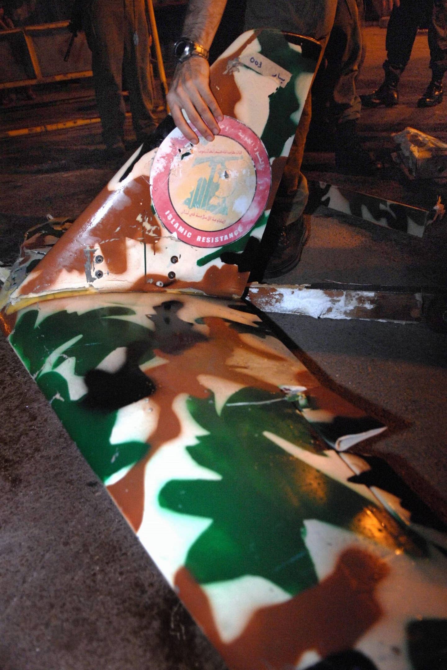 In this photo released by the Israeli Defense Forces, the remains of a Hezbollah drone are displayed by Israeli soldiers after it was shot down by an Israeli Air Force jet on August 7, 2006, over Israel. <em>Photo by Anna Brosh/IDF via Getty Images</em>