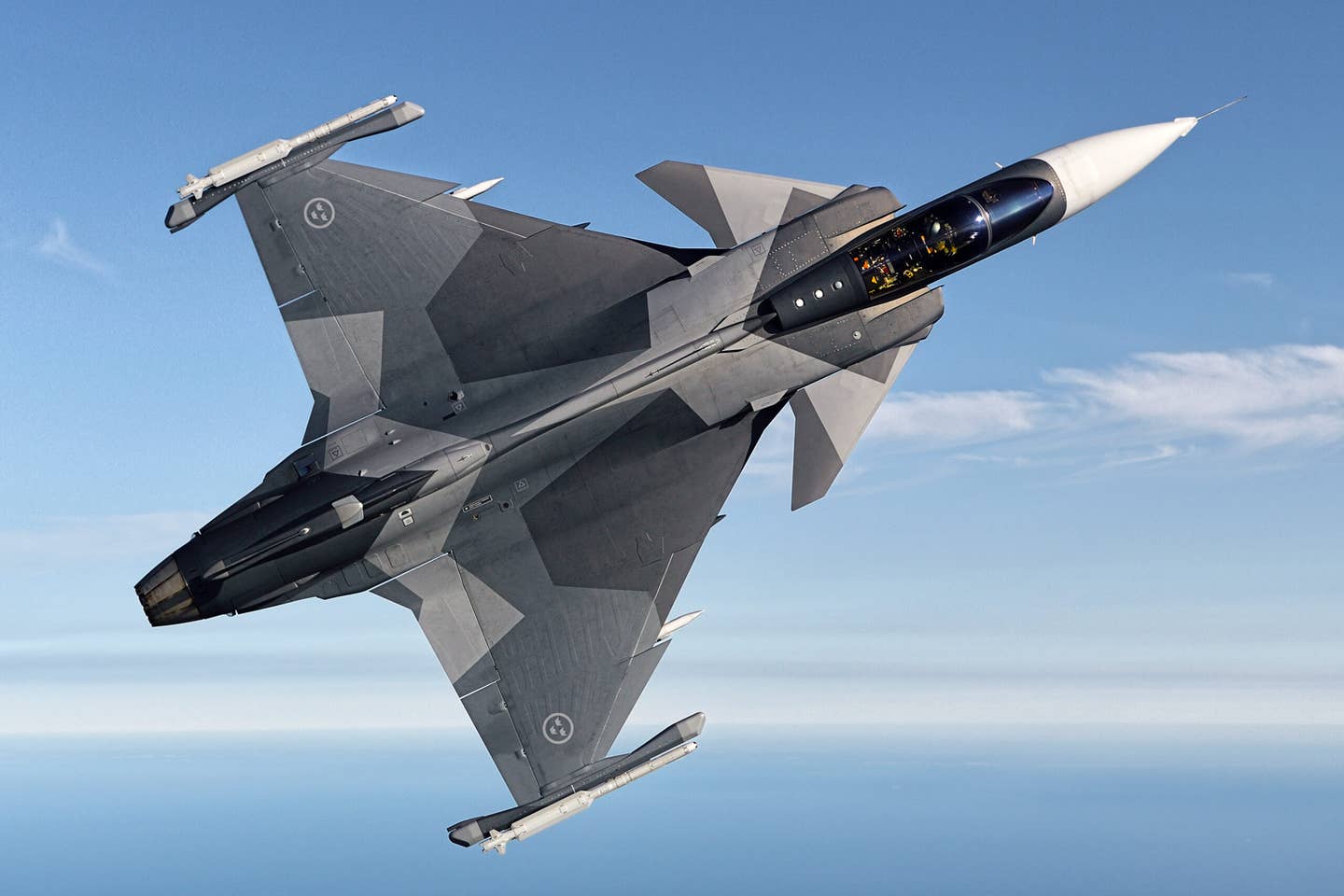 An earlier view of the same Gripen E jet with its original wing platform. <em>Saab</em>