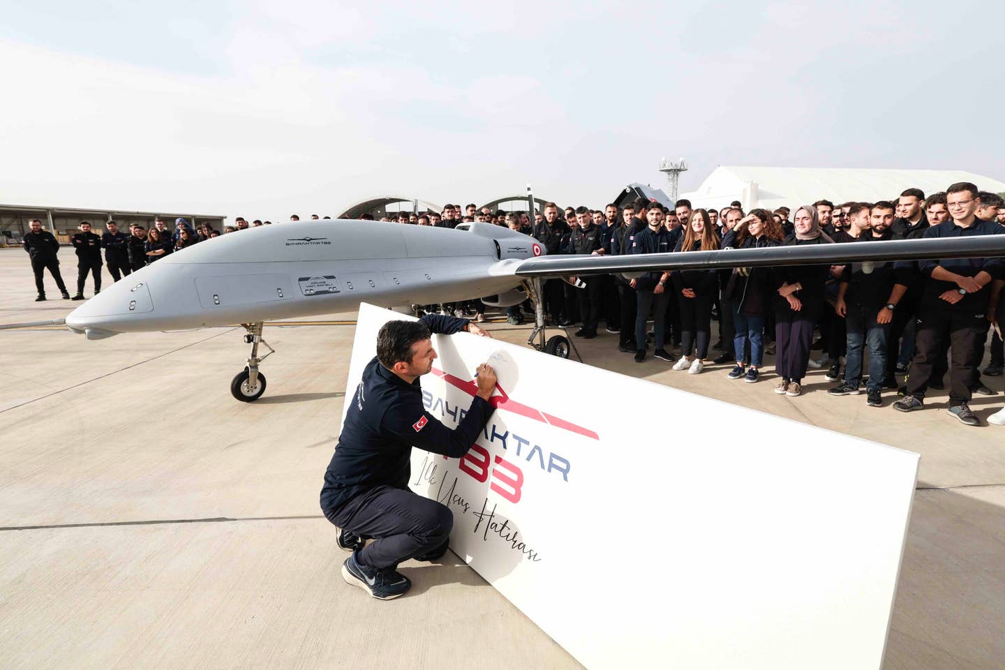 Selçuk Bayraktar pictures beside TB3 at the Çorlu Flight Training and Test Center, October 27. <em>Baykar</em>