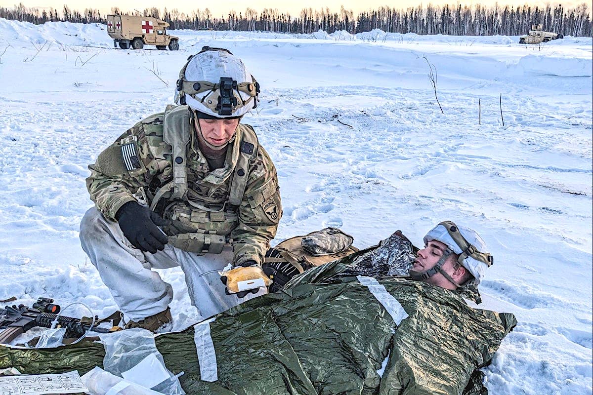 Army personnel conducting casualty care training in Alaska. <em>US Army</em>