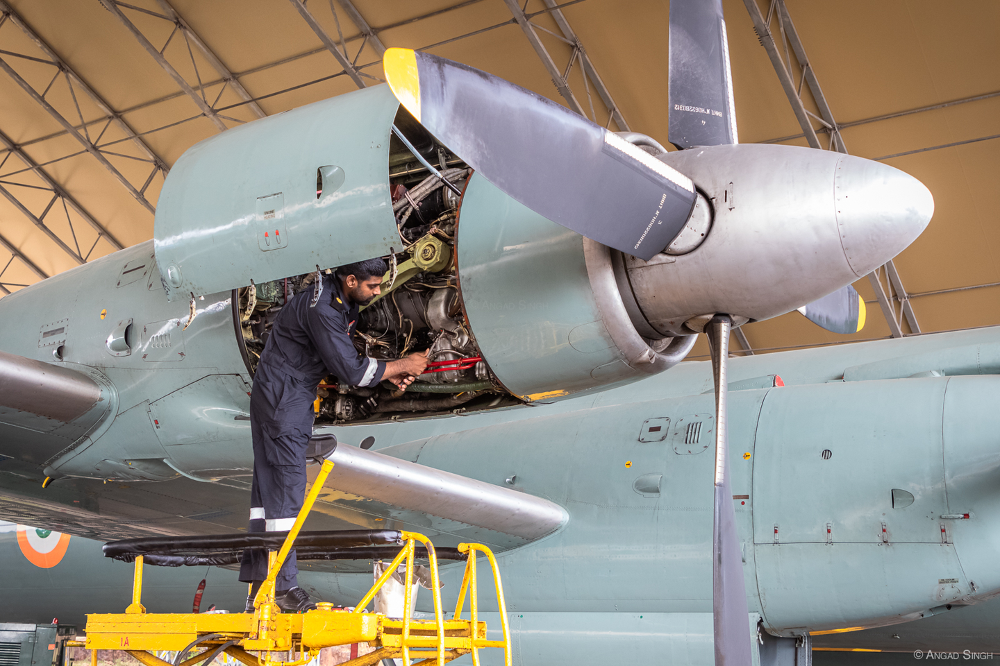 A maintainer at work on one of the Il-38’s four Ivchenko AI-20M turboprops. <em>Angad Singh</em>