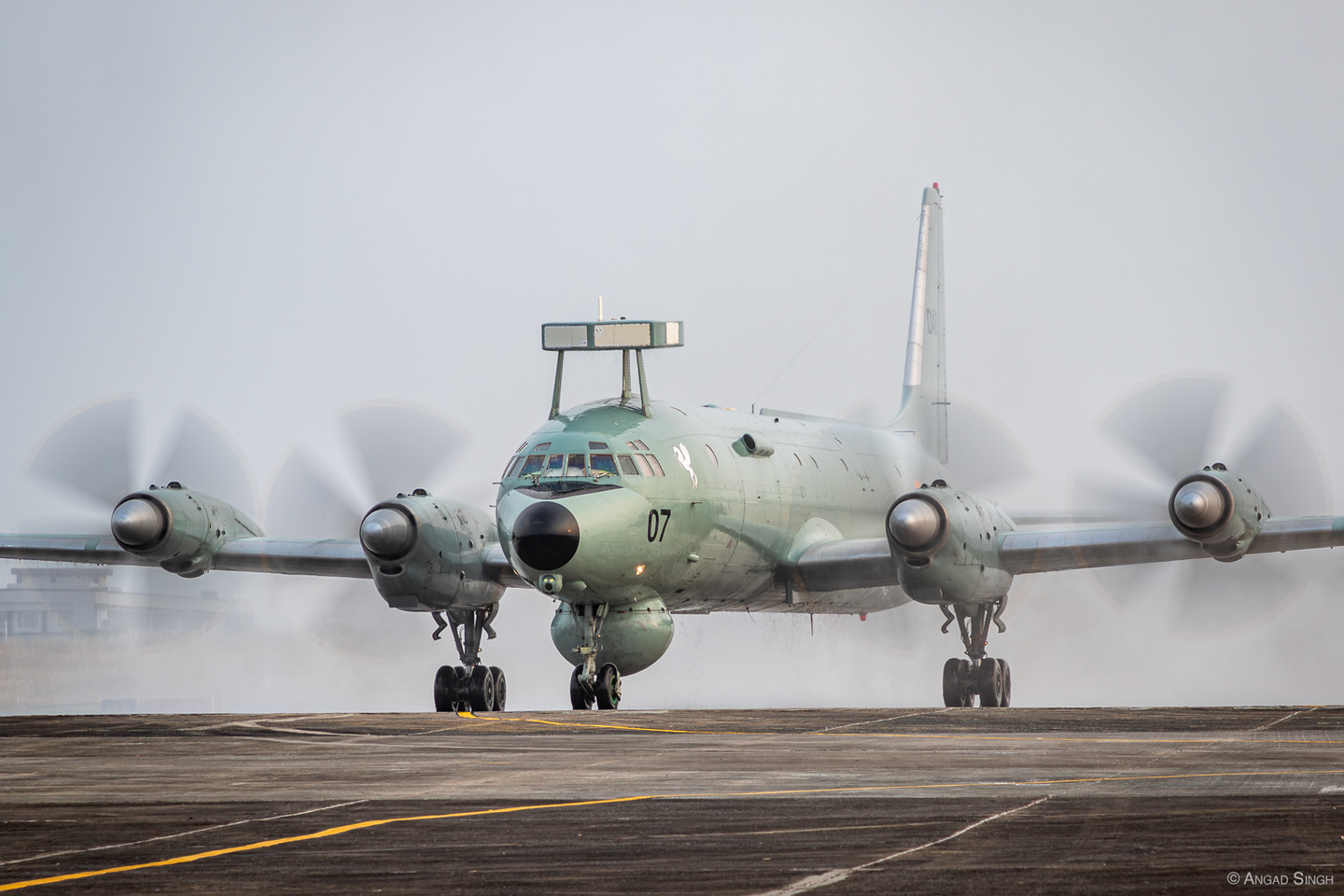 Serial IN307, which was the last flying Il-38SD, taxis in under the spray of water cannons. <em>Angad Singh</em>