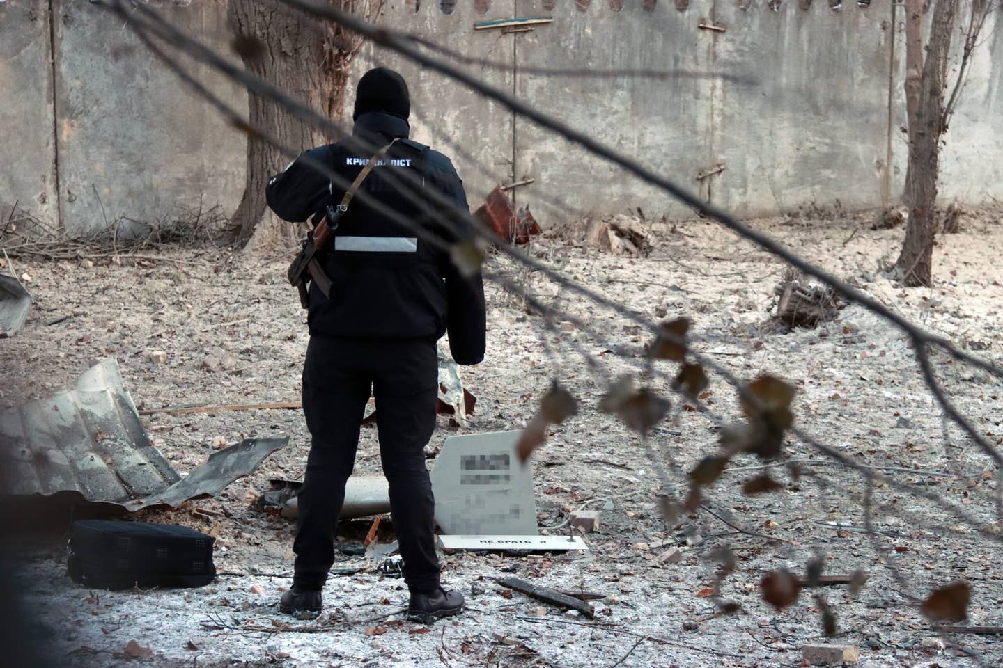 A forensic expert stands by a fragment of a kamikaze drone in the Shevchenkivskyi district of Kyiv last year. (Photo credit should read Anatolii Siryk / Ukrinform/Future Publishing via Getty Images)