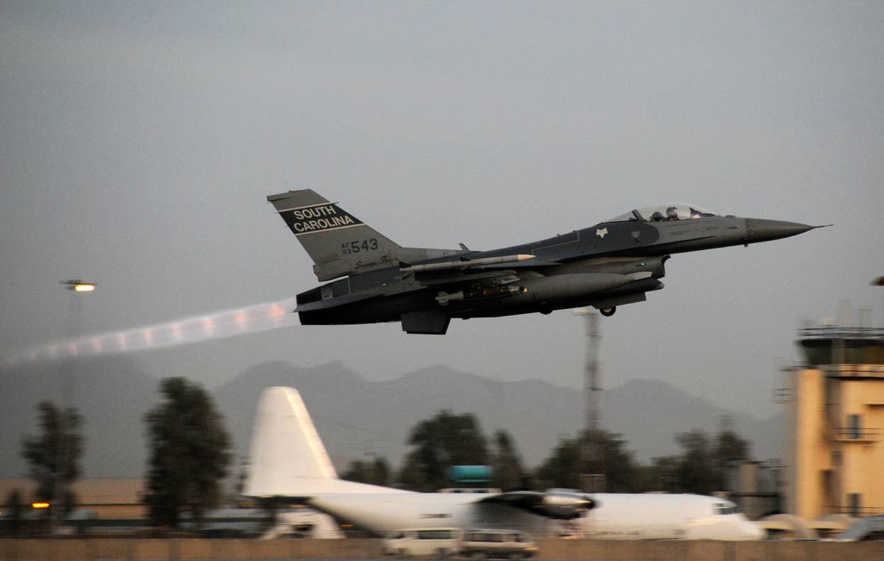 F-16 in full afterburner, a string of shock diamonds emanating from its F100 turbofan. <em>Tech. Sgt. Caycee Cook</em>/<em>USAF</em>