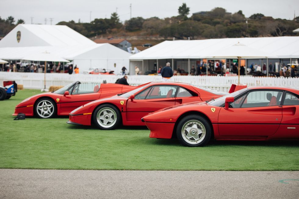 a group of cars parked on grass