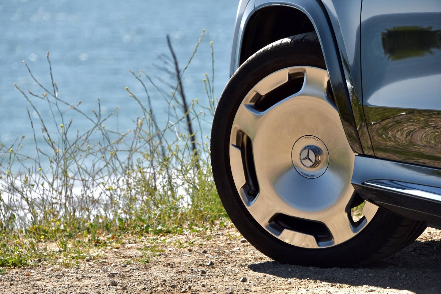 2024 Mercedes-Maybach GLS 600 23-inch wheel against the Pacific Ocean