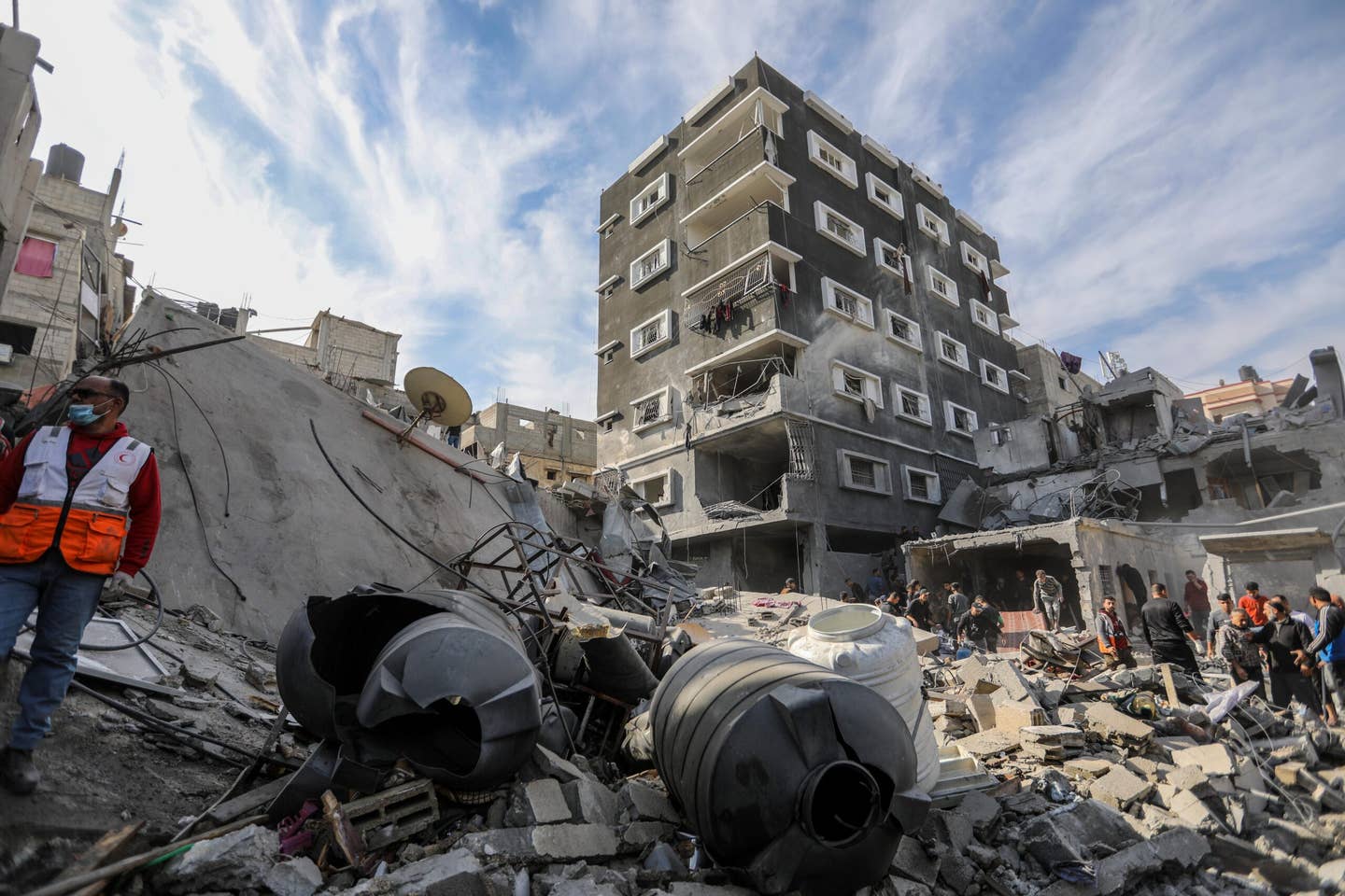 Palestinian citizens carry out search and rescue operations amid the destruction caused by Israeli air strikes on December 08, 2023 in Khan Yunis, Gaza. Israel has stepped up military operations in southern Gaza after a sustained truce with Hamas did not hold further than a week despite diplomatic talks and captives released. (Photo by Ahmad Hasaballah/Getty Images)