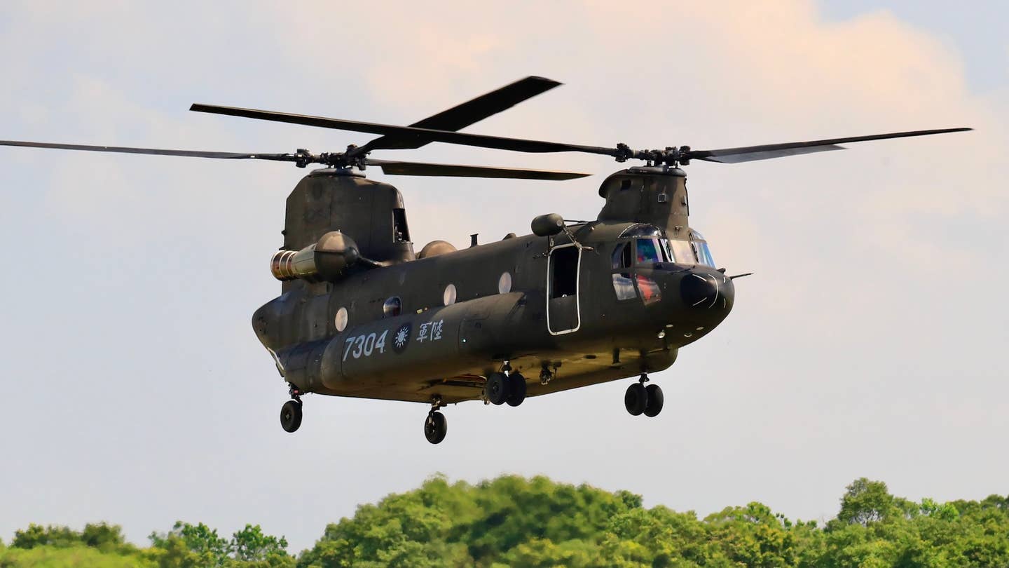 A Chinook Helicopter flies over a military camp, as part of a rehearsal for the flyby performance for Taiwan’s Double-Ten National Day Celebration, amid rising tensions between Beijing and Taipei and threats from China, in Taoyuan, Taiwan, 28 September 2021. The 18-meter wide and 12-meter long Taiwan flag, according to state media Central News Agency, will be carried by two CH-47 Chinook helicopters flag flying over the Presidential Office, in addition to a parade displaying the island’s missile systems which will showcase the armed forces' ability to resist threats from China. (Photo by Ceng Shou Yi/NurPhoto)