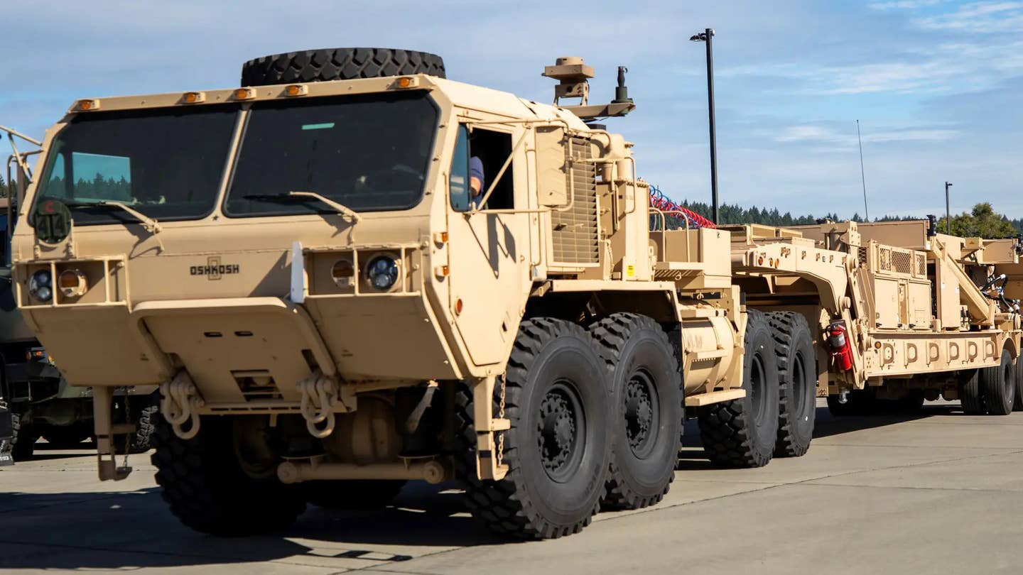 An M983A4 tractor truck towing a Dark Eagle launcher trailer. <em>US Army</em>