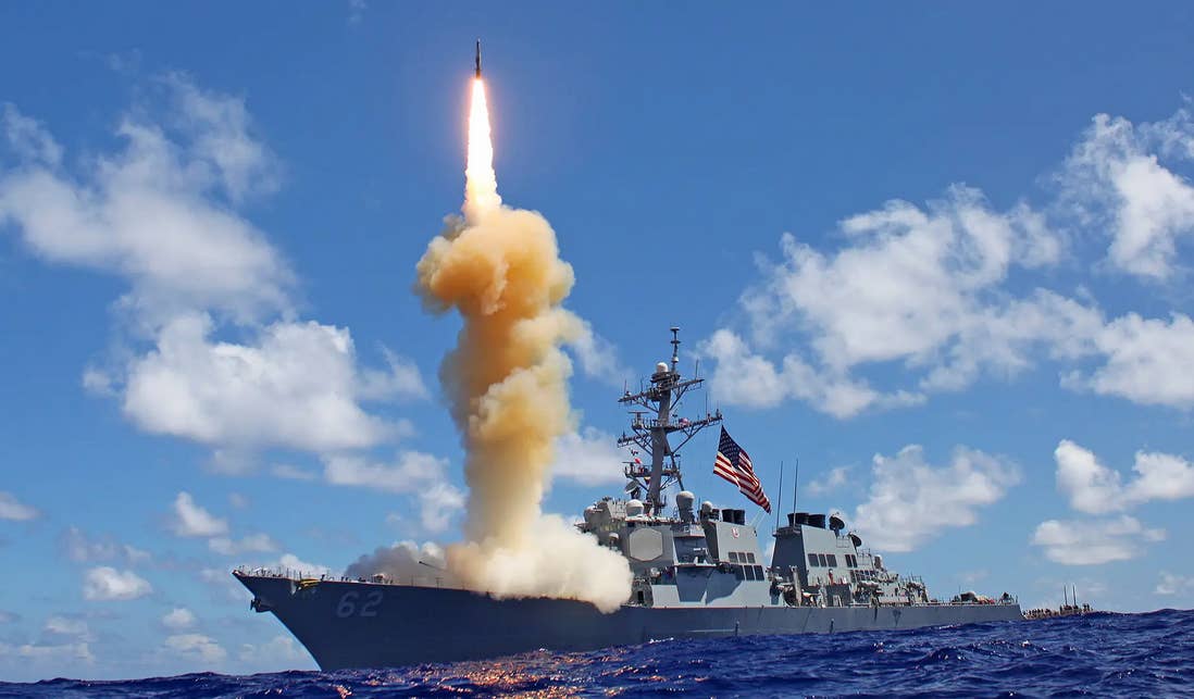 A U.S. Navy destroyer fires as Standard missile. (USN)