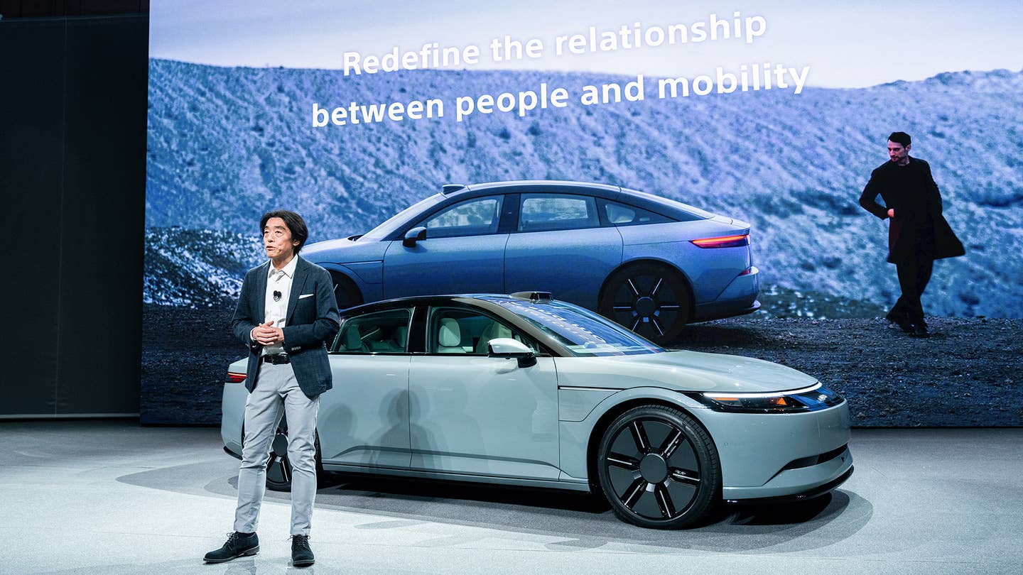 At bottom, Sony Honda Mobility COO Izumi Kawanishi presents the latest Afeela prototype at CES 2024.