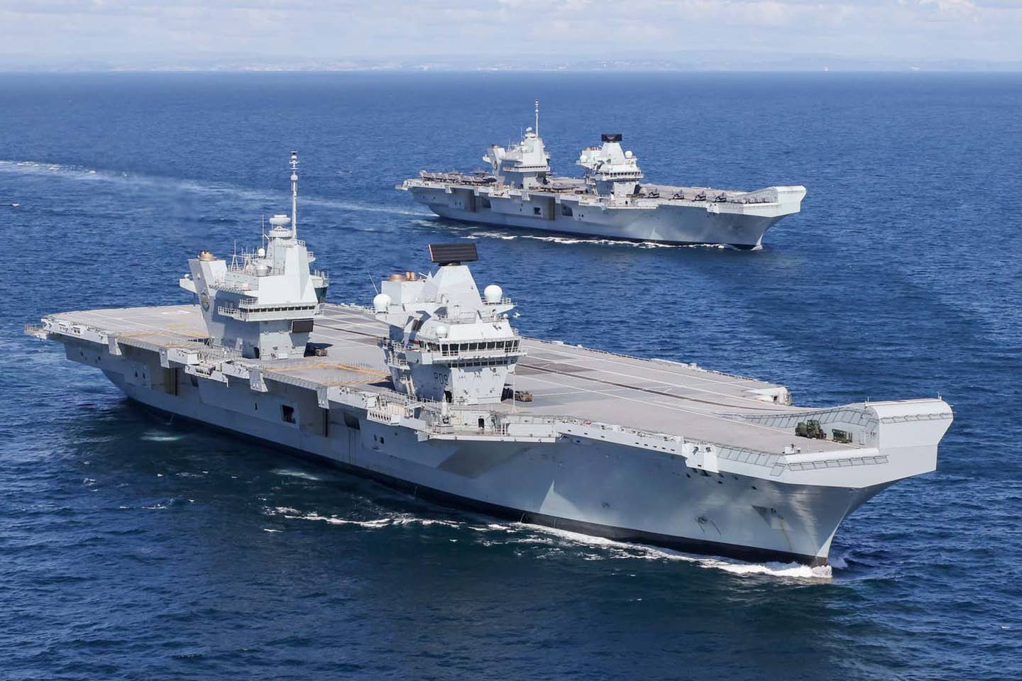 HMS <em>Prince of Wales</em> and HMS <em>Queen Elizabeth</em> pictured at sea for the first time. Wednesday 19 May 2021 saw a historic moment in Britain’s carrier renaissance as HMS <em>Queen Elizabeth</em> and HMS <em>Prince of Wale</em>s met at sea for the first time. <em>Petty Officer Photographer Jay Allen</em>
