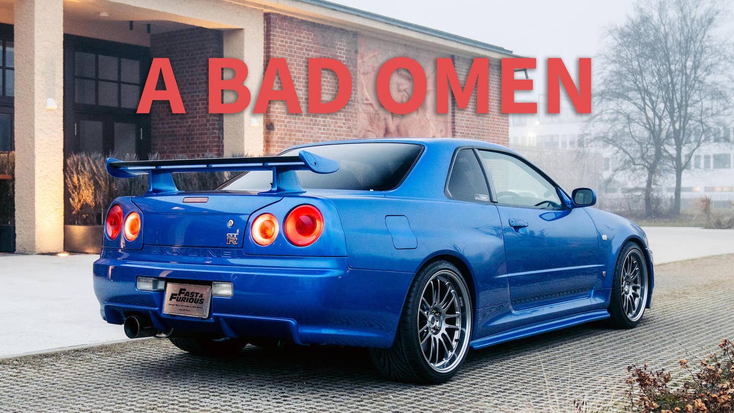 A blue R34 Nissan Skyline GT-R