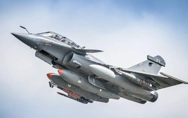 A French Rafale fighter carrying two 2,200-pound (1,000-kilogram) class Hammer bombs during a test. <em>French Ministry of Defense</em>