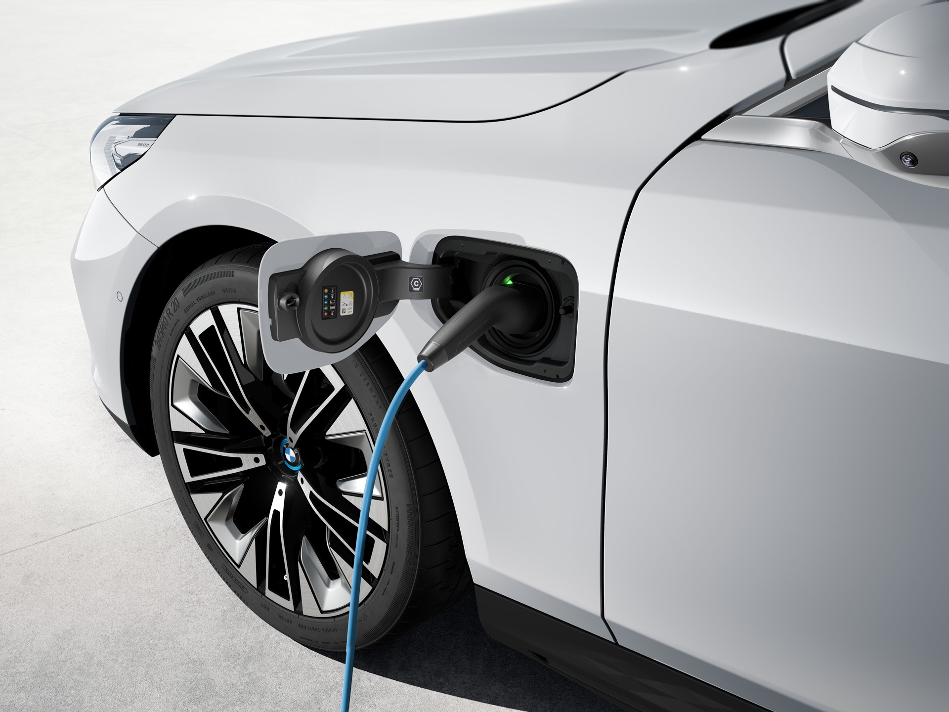 BMW electric wagon, Kia Carnival Hybrid minivan, Tesla chargers at hotels: Today’s Car News