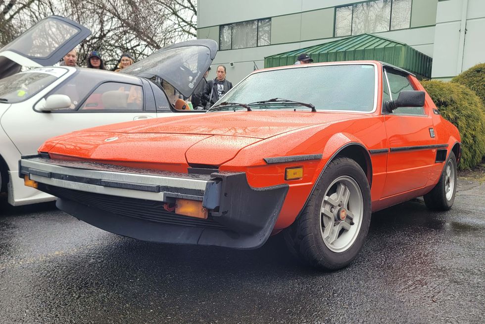 a fiat x19 with the hood up