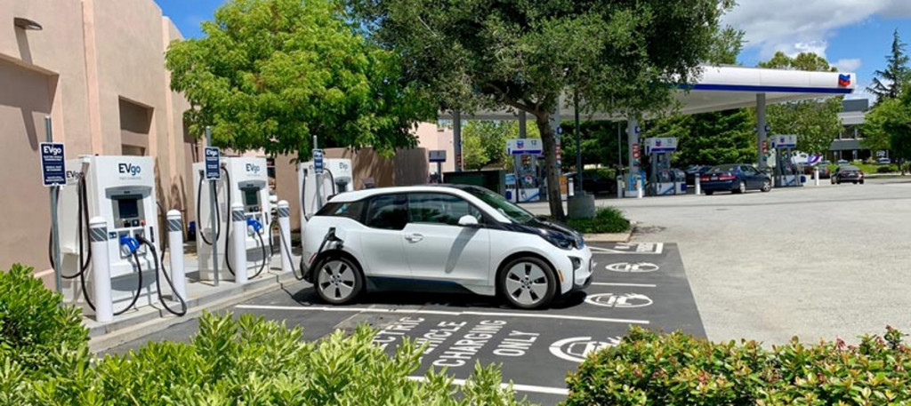 BMW i3 charging at EVgo fast chargers at Chevron station in Menlo Park, California