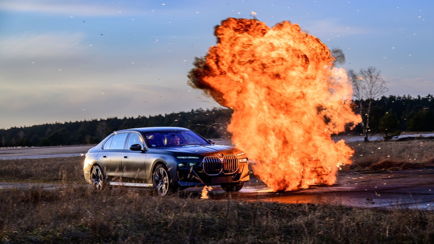 Car driving into a wall of fire