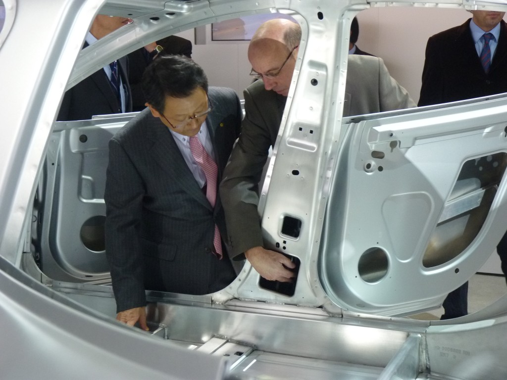 Toyota Motor Corporation president Akio Toyoda, at Tesla stand, 2011 Detroit Auto Show