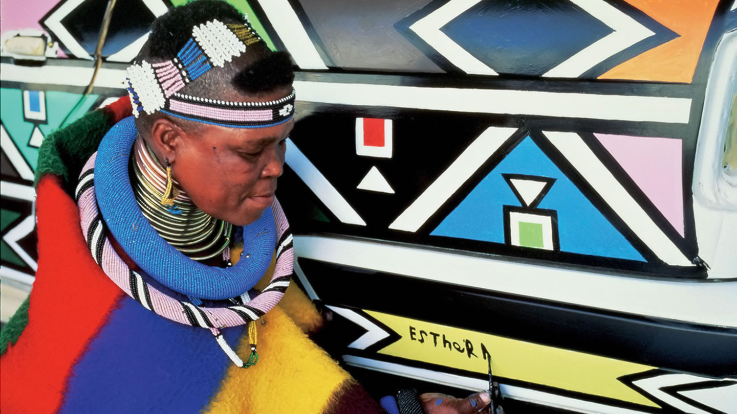 Artist Esther Mahlangu signs her first BMW art car in 1991. 