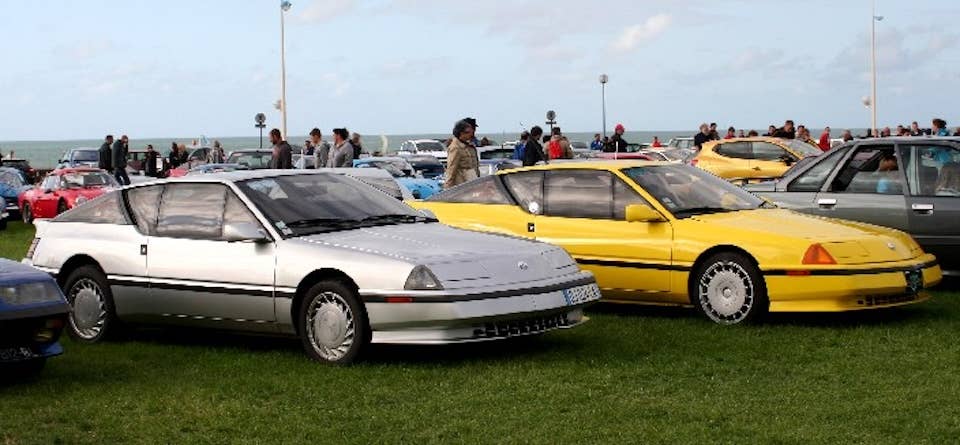 Surviving AMC GTA USA prototypes on display in Europe. Note their protruding front bumpers and flip-up headlights.